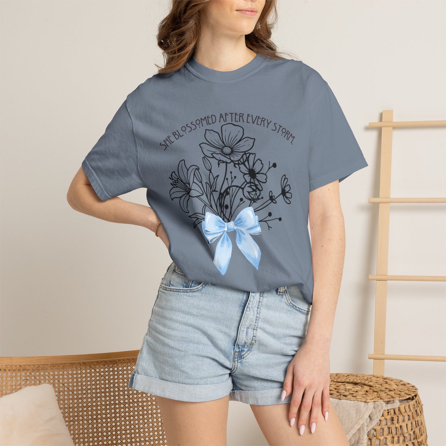 T-Shirt — 'She Blossomed After Every Storm' Floral Bouquet Tee with Blue Ribbon
