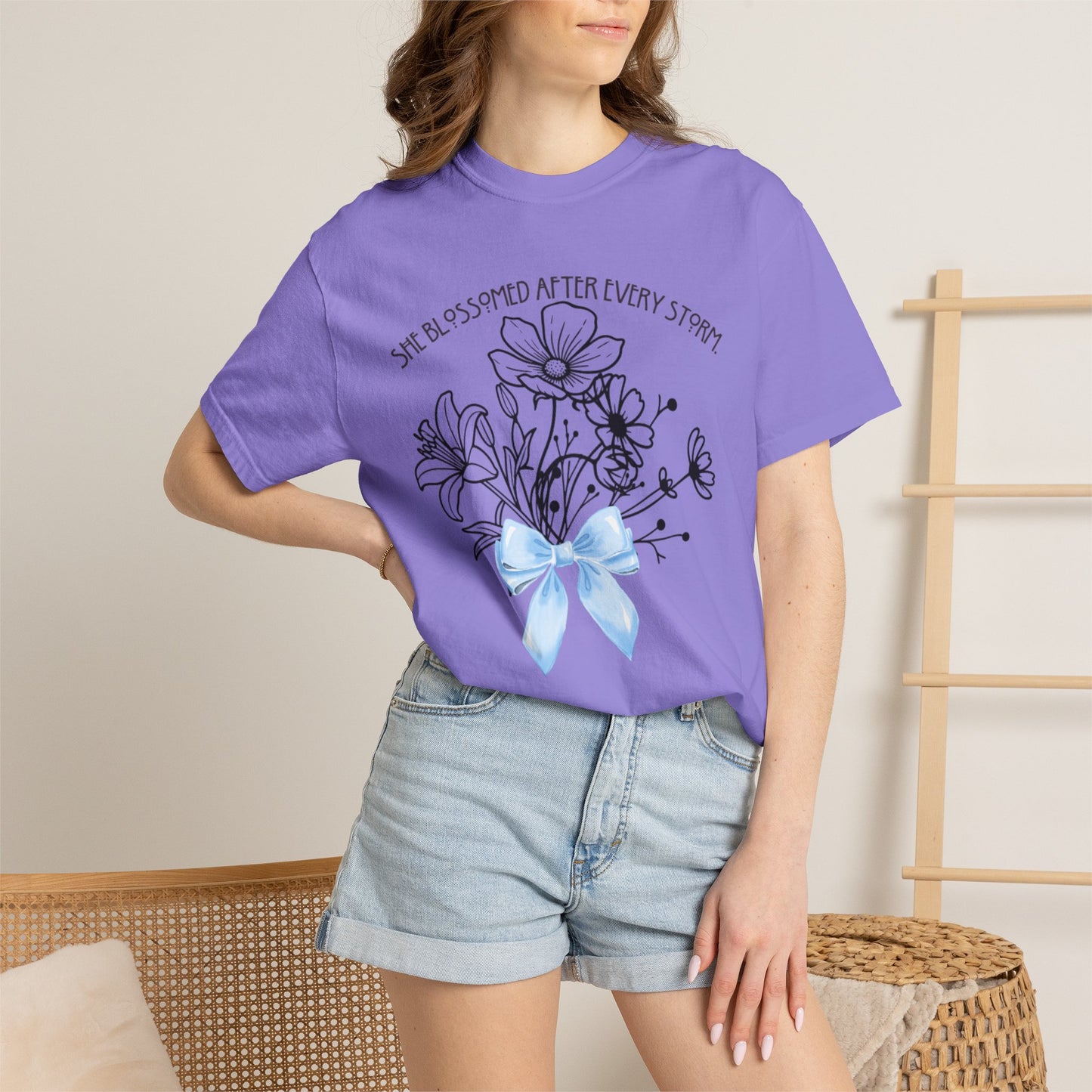 T-Shirt — 'She Blossomed After Every Storm' Floral Bouquet Tee with Blue Ribbon