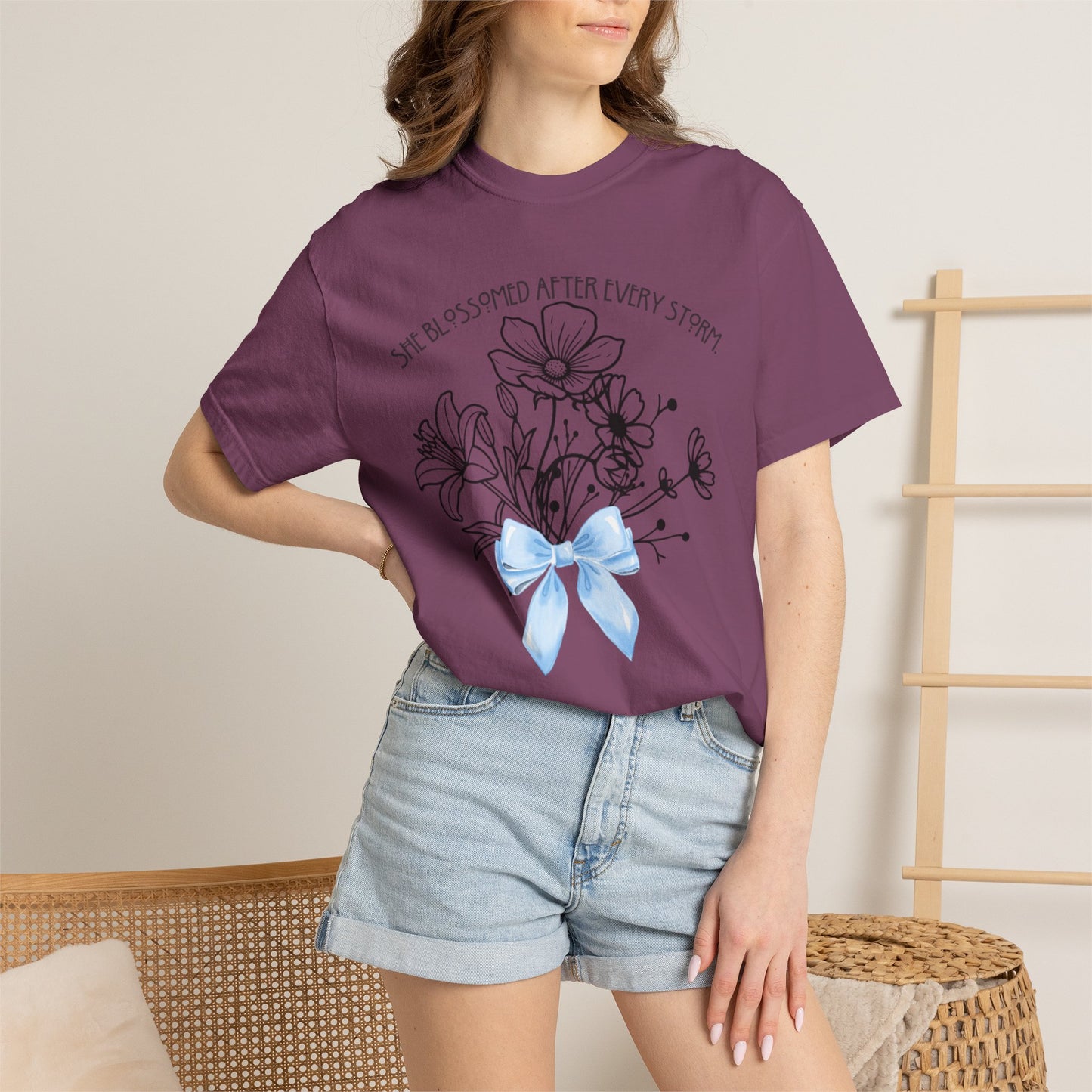 T-Shirt — 'She Blossomed After Every Storm' Floral Bouquet Tee with Blue Ribbon