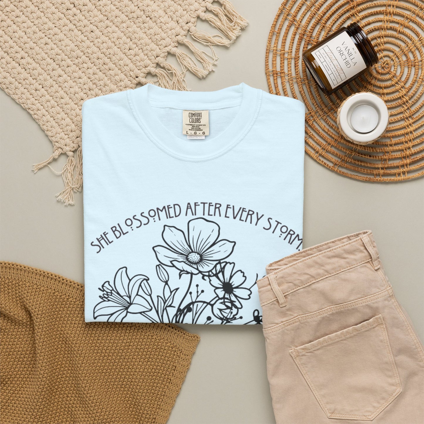 T-Shirt — 'She Blossomed After Every Storm' Floral Bouquet Tee with Blue Ribbon