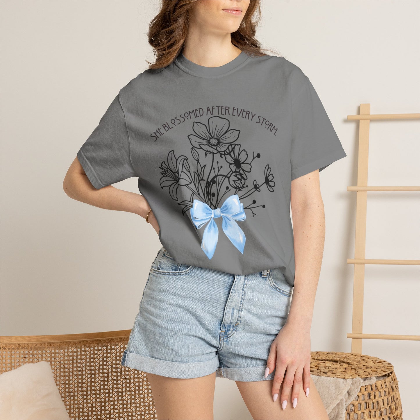 T-Shirt — 'She Blossomed After Every Storm' Floral Bouquet Tee with Blue Ribbon