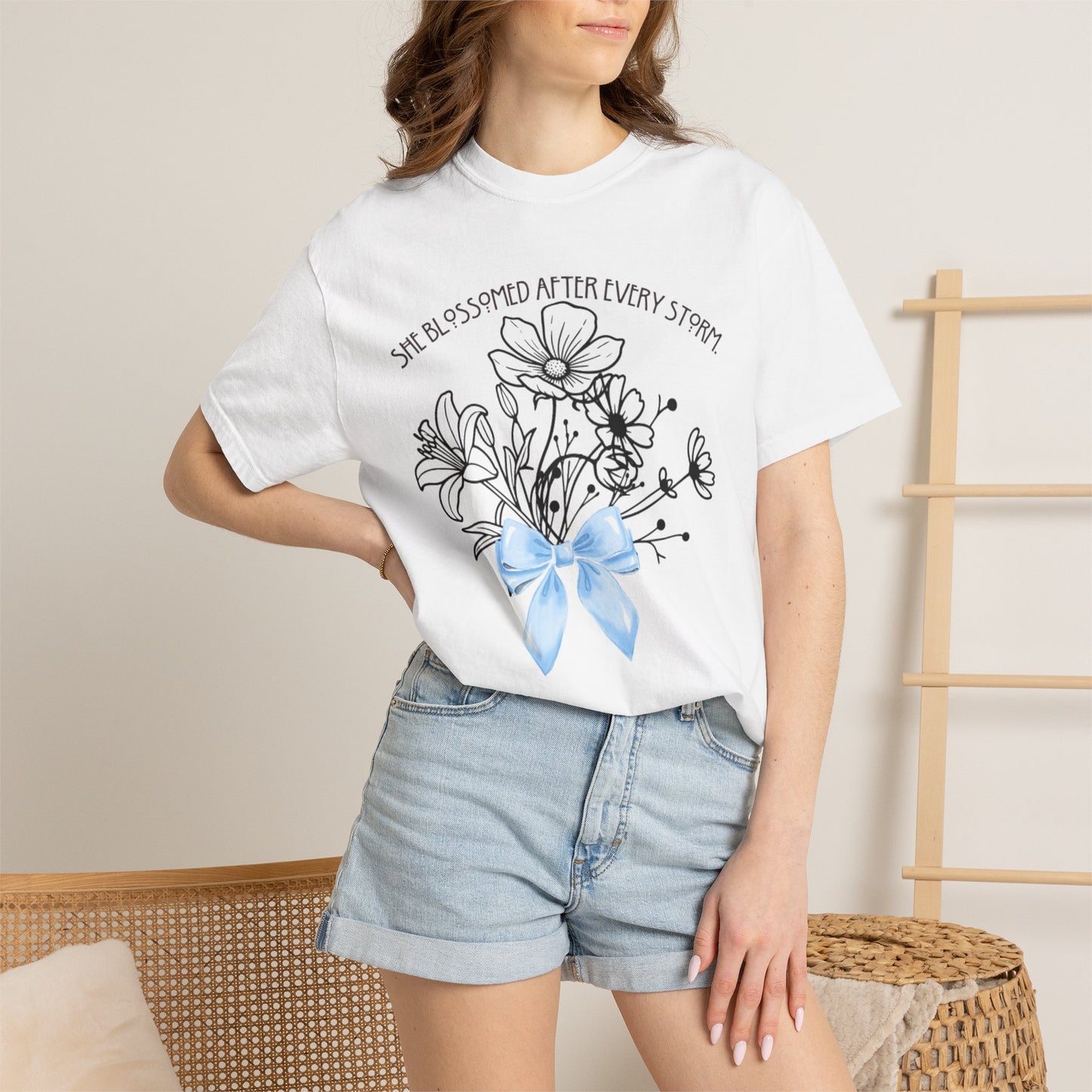 T-Shirt — 'She Blossomed After Every Storm' Floral Bouquet Tee with Blue Ribbon