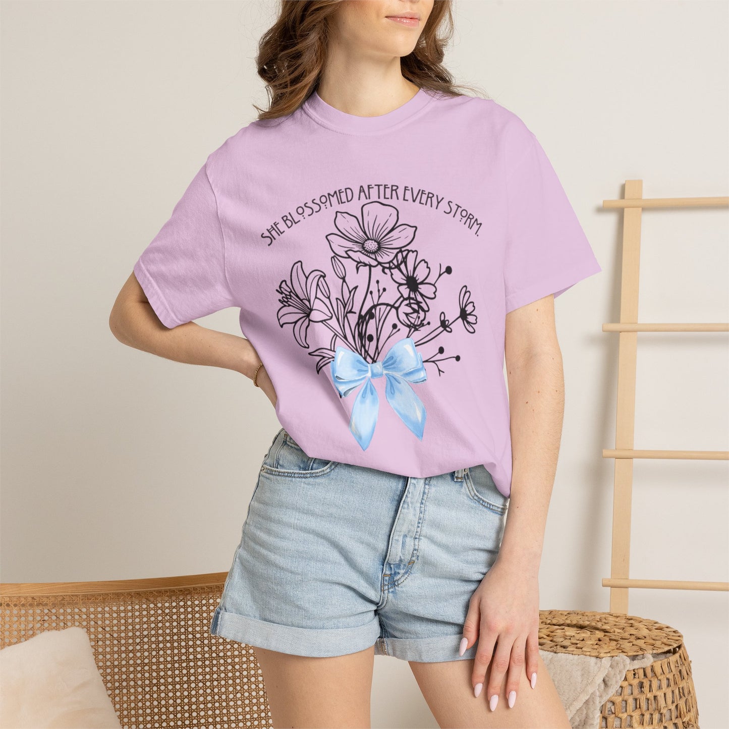 T-Shirt — 'She Blossomed After Every Storm' Floral Bouquet Tee with Blue Ribbon